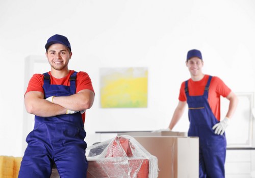 Man and van removals service in Wimbledon with moving boxes and furniture