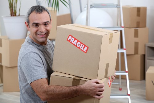 Removal team handling household items during a move