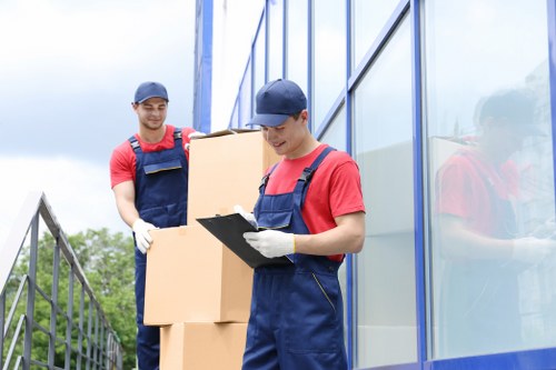 Professional movers handling furniture for a Wimbledon flat move