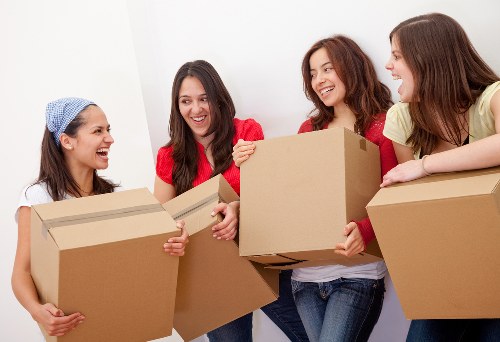 Team preparing a home move with packed boxes
