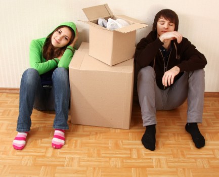 Packed moving boxes and furniture ready for transport