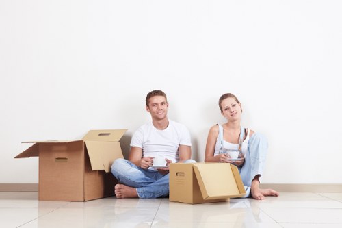 Professional movers handling furniture during a Wimbledon house relocation