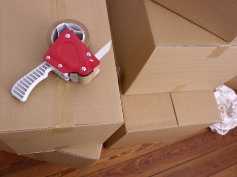 Furniture and household items being transported by a Wimbledon van service