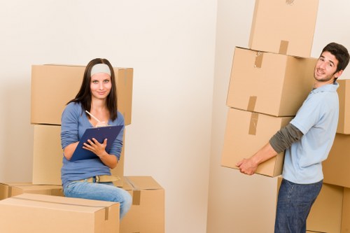Local moving team handling boxes in Wimbledon